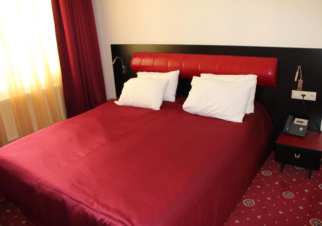 Postel nebo postele na pokoji v ubytování Hotel Villa Palace