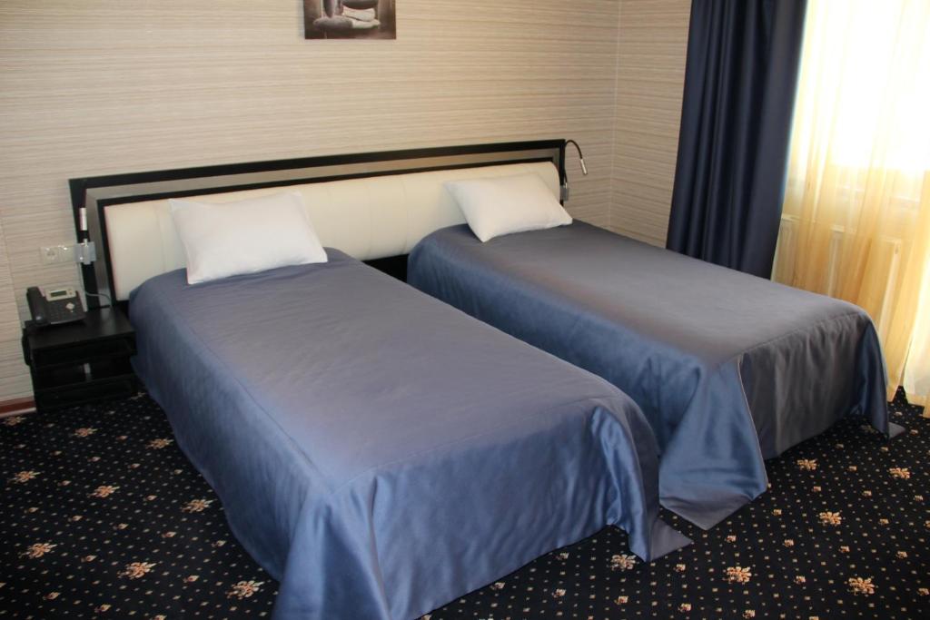 Postel nebo postele na pokoji v ubytování Hotel Villa Palace