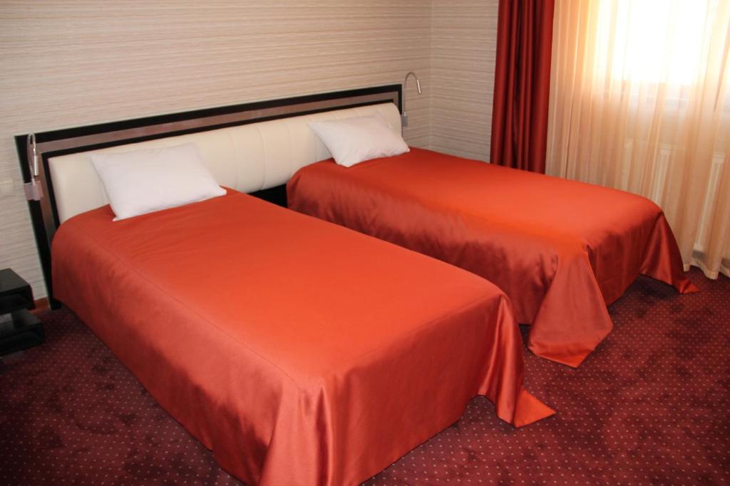 Postel nebo postele na pokoji v ubytování Hotel Villa Palace