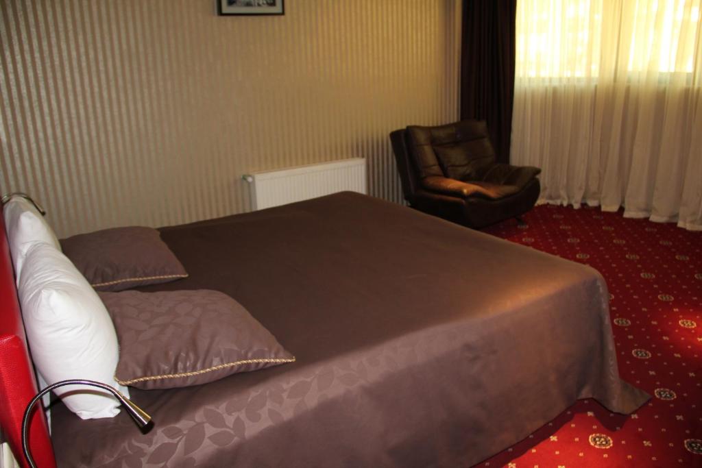 Postel nebo postele na pokoji v ubytování Hotel Villa Palace