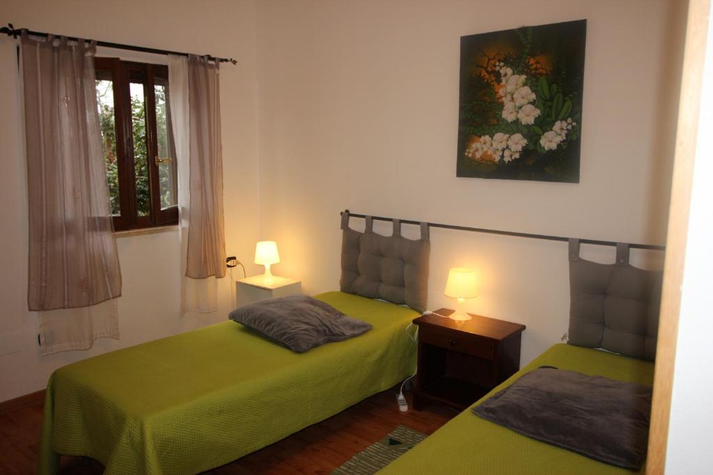A bed or beds in a room at rita