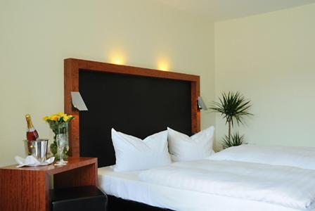 Postel nebo postele na pokoji v ubytování Hotel Prinzen