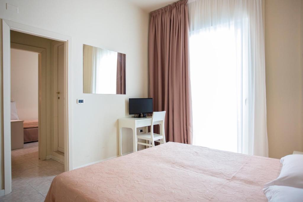 Postel nebo postele na pokoji v ubytování Sirena Boutique Hotel