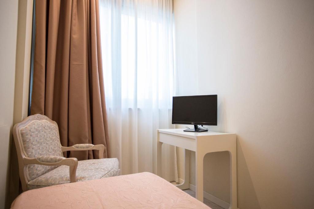 TV a/nebo společenská místnost v ubytování Sirena Boutique Hotel