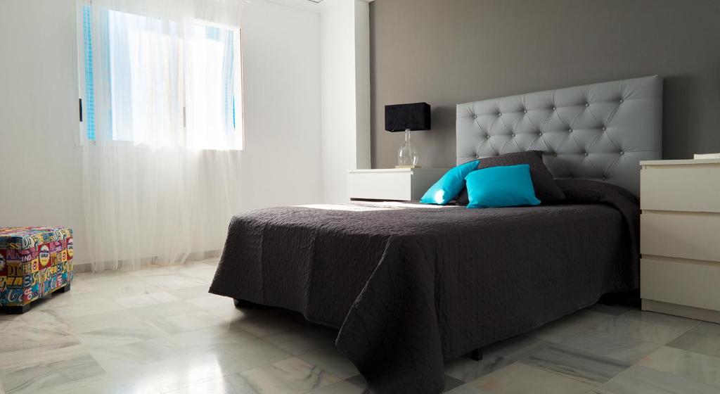 Postel nebo postele na pokoji v ubytování Apartamentos Alberca - Deniasol