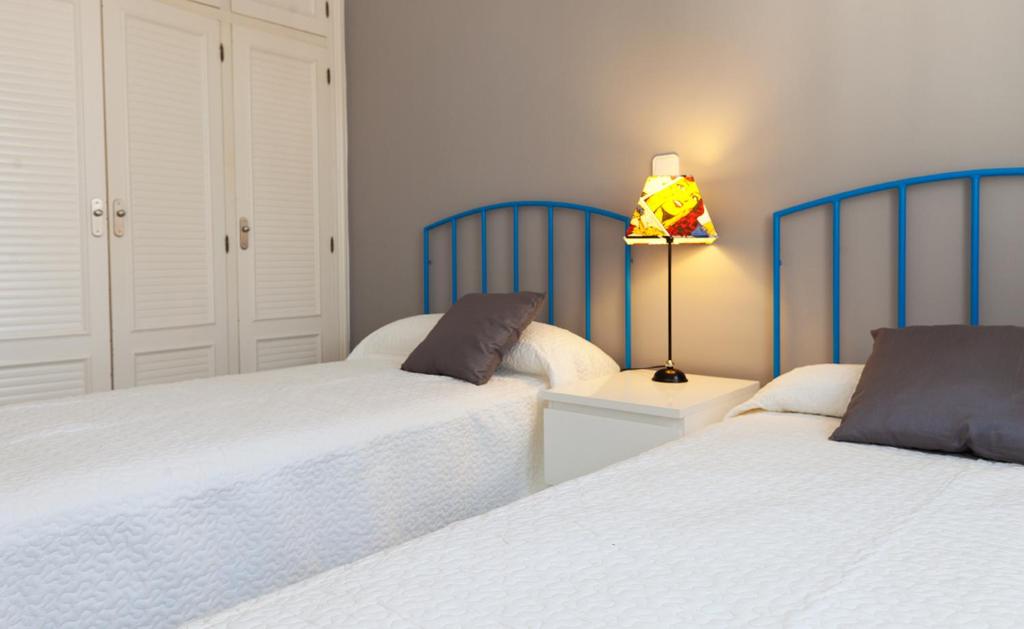 Postel nebo postele na pokoji v ubytování Apartamentos Alberca - Deniasol