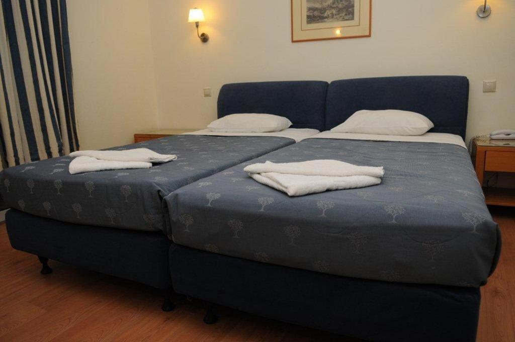 Posteľ alebo postele v izbe v ubytovaní Hotel Pantheon