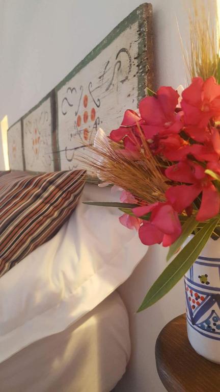 Postel nebo postele na pokoji v ubytování B&B Tre Giummare