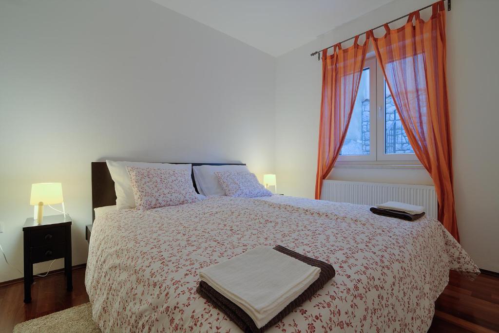 Posteľ alebo postele v izbe v ubytovaní Apartment Kuk