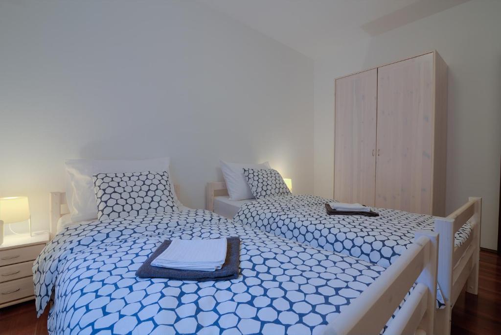 Posteľ alebo postele v izbe v ubytovaní Apartment Kuk