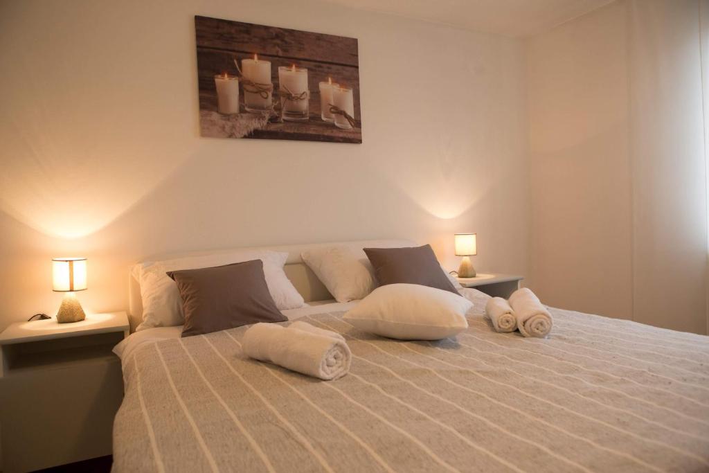 a bedroom with a bed with two pillows on it at Apartman Antea in Otočac
