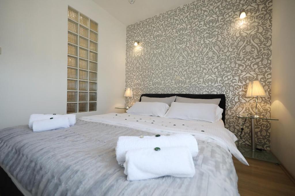 Posteľ alebo postele v izbe v ubytovaní Top Apartments Zadar