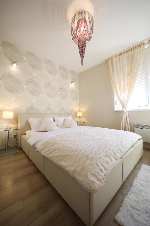 Posteľ alebo postele v izbe v ubytovaní Top Apartments Zadar