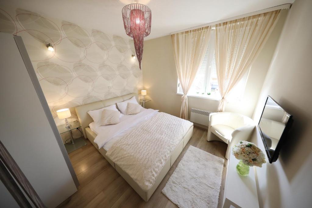 Posteľ alebo postele v izbe v ubytovaní Top Apartments Zadar