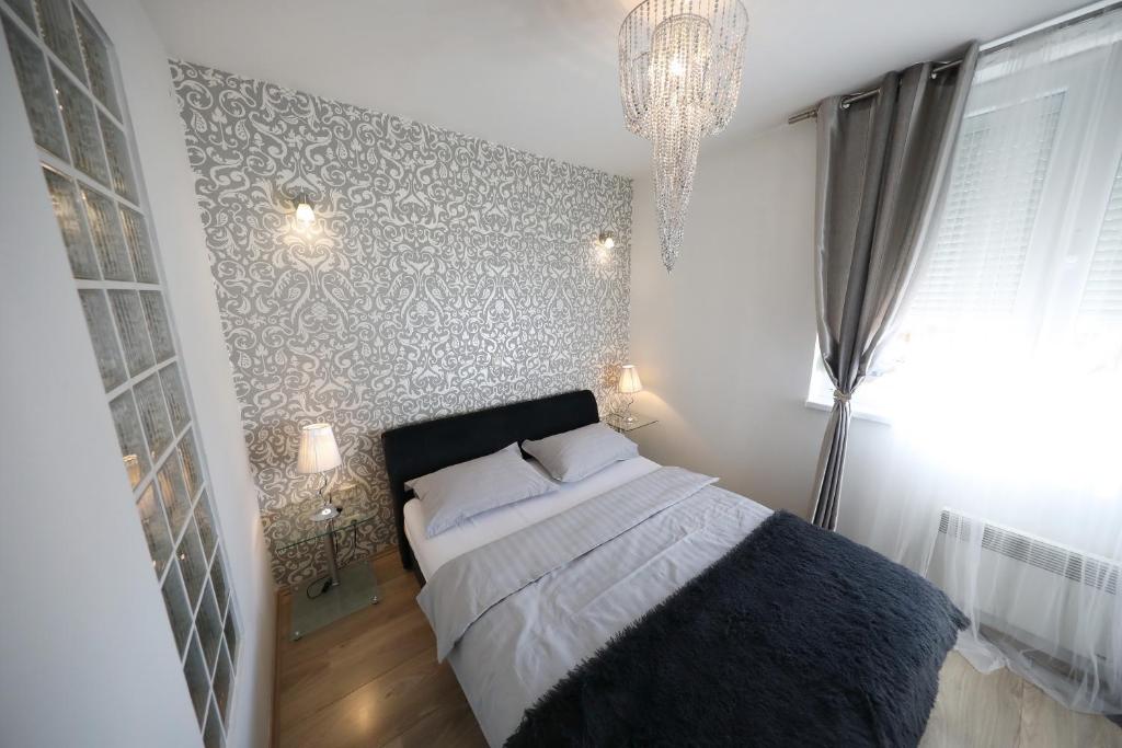 Posteľ alebo postele v izbe v ubytovaní Top Apartments Zadar