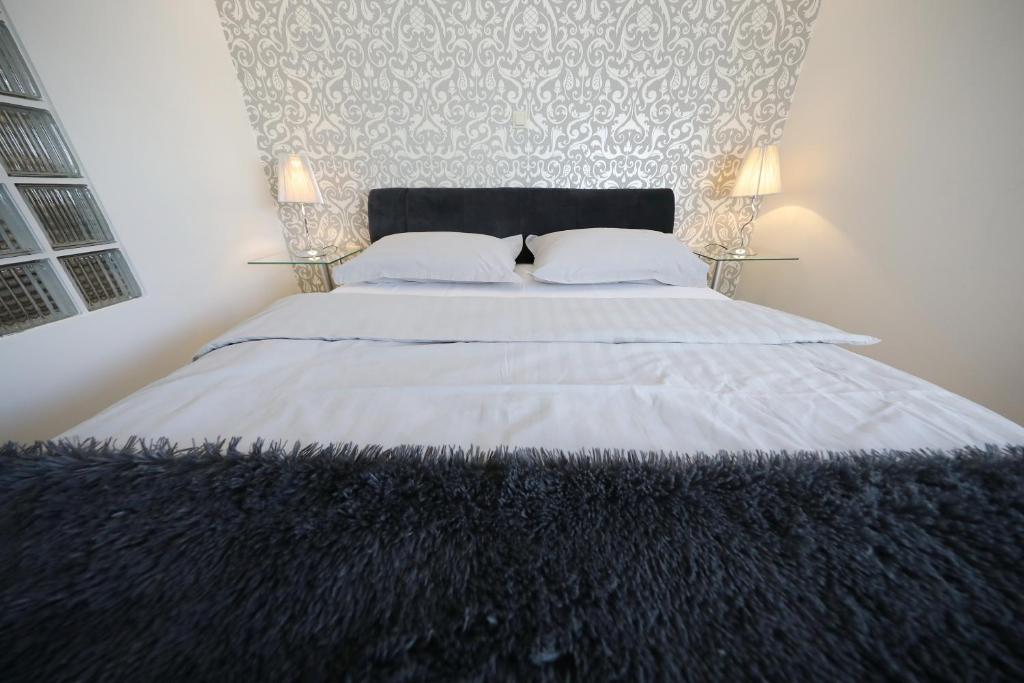 Posteľ alebo postele v izbe v ubytovaní Top Apartments Zadar