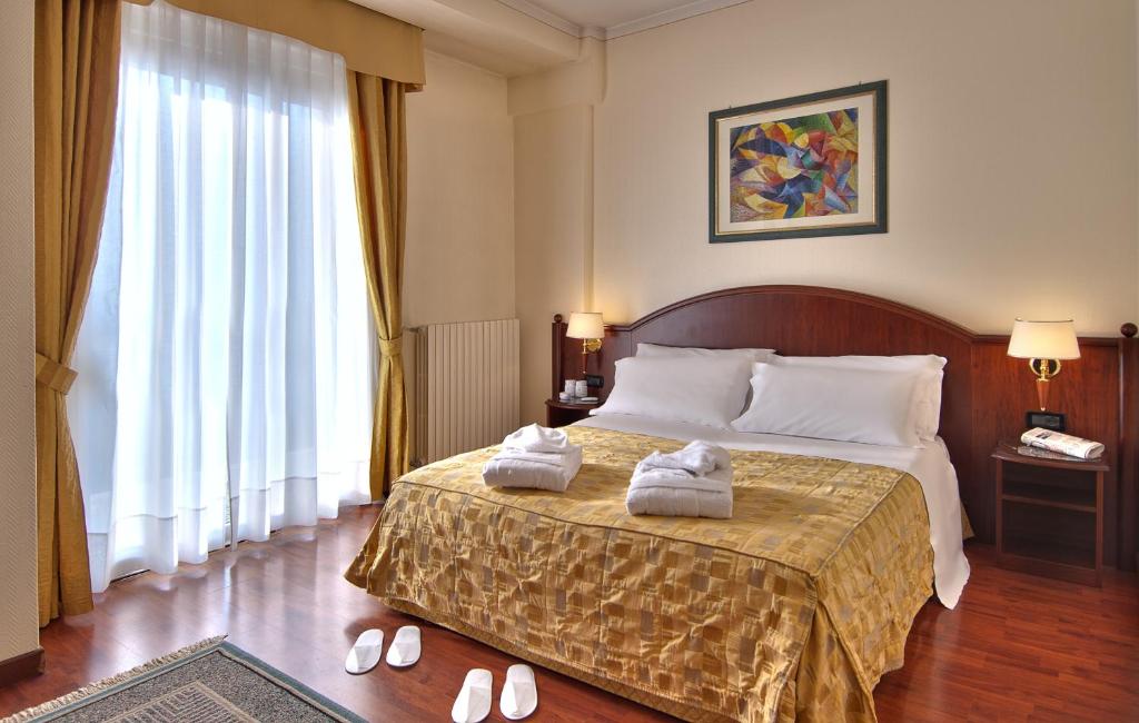 Postel nebo postele na pokoji v ubytování Hotel Eliseo Terme
