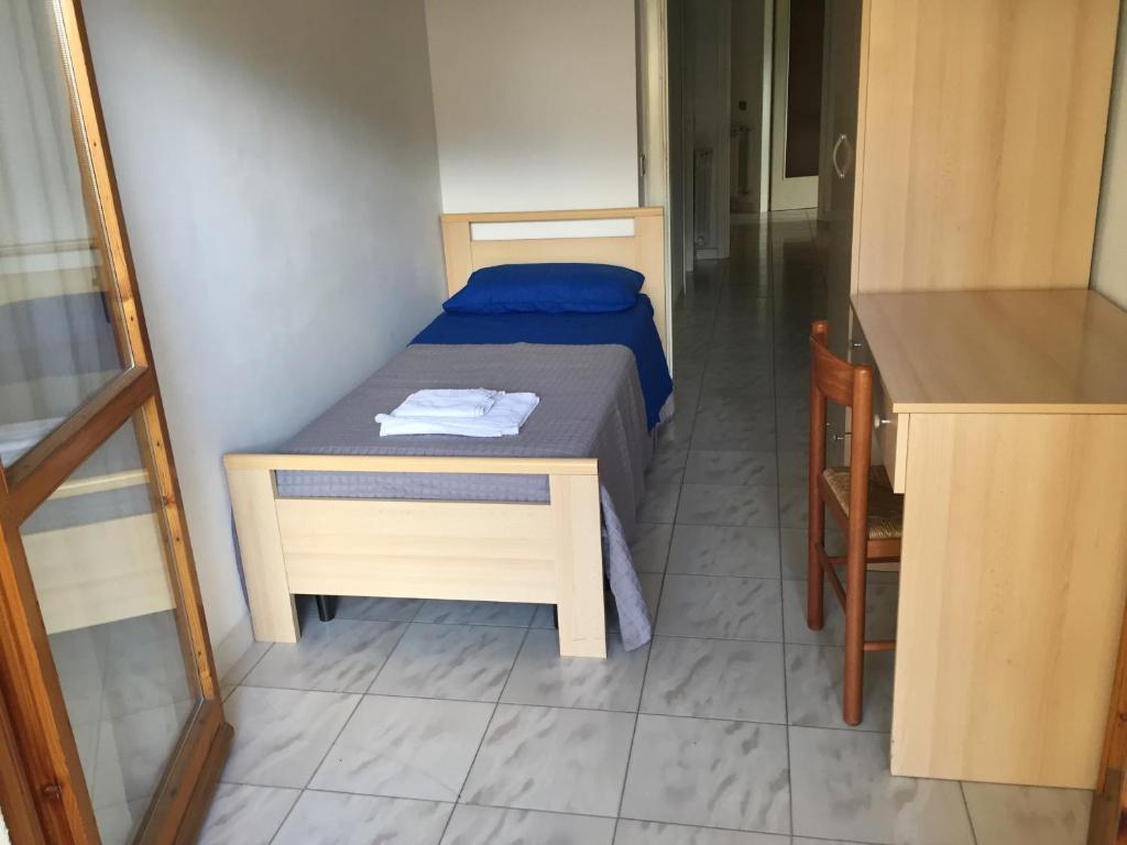 Łóżko lub łóżka w pokoju w obiekcie Appartamento Belvedere