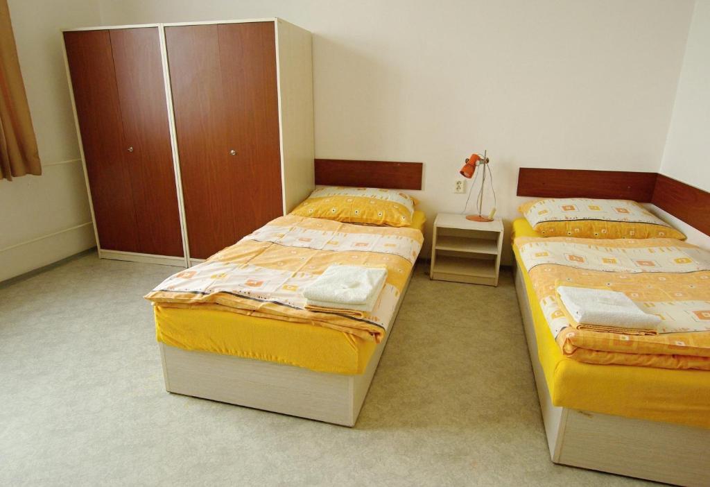 Postel nebo postele na pokoji v ubytování Koleje Zamecek