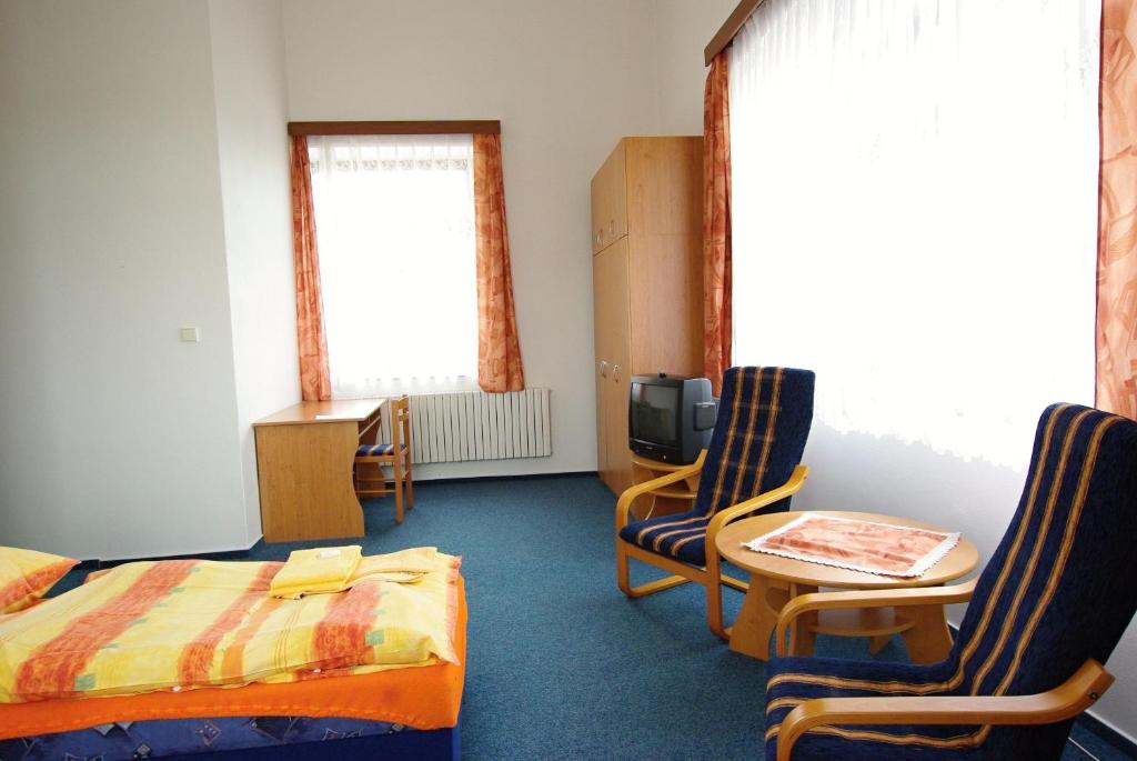 Postel nebo postele na pokoji v ubytování Koleje Zamecek