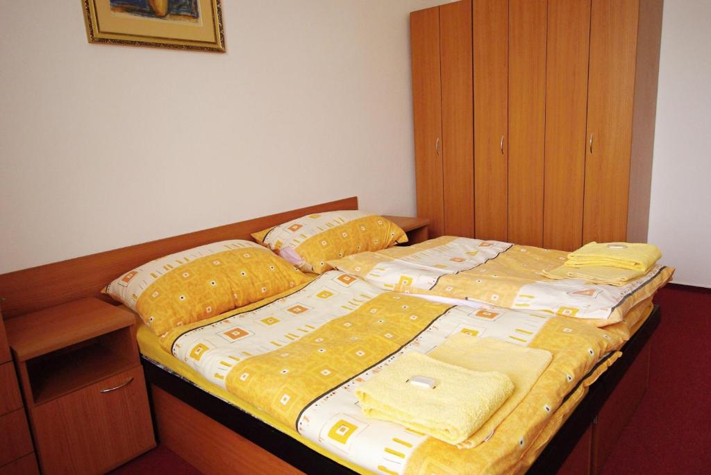 Postel nebo postele na pokoji v ubytování Koleje Zamecek