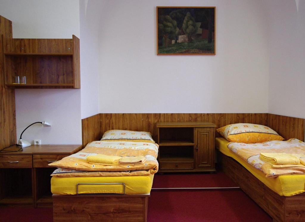 Postel nebo postele na pokoji v ubytování Koleje Zamecek