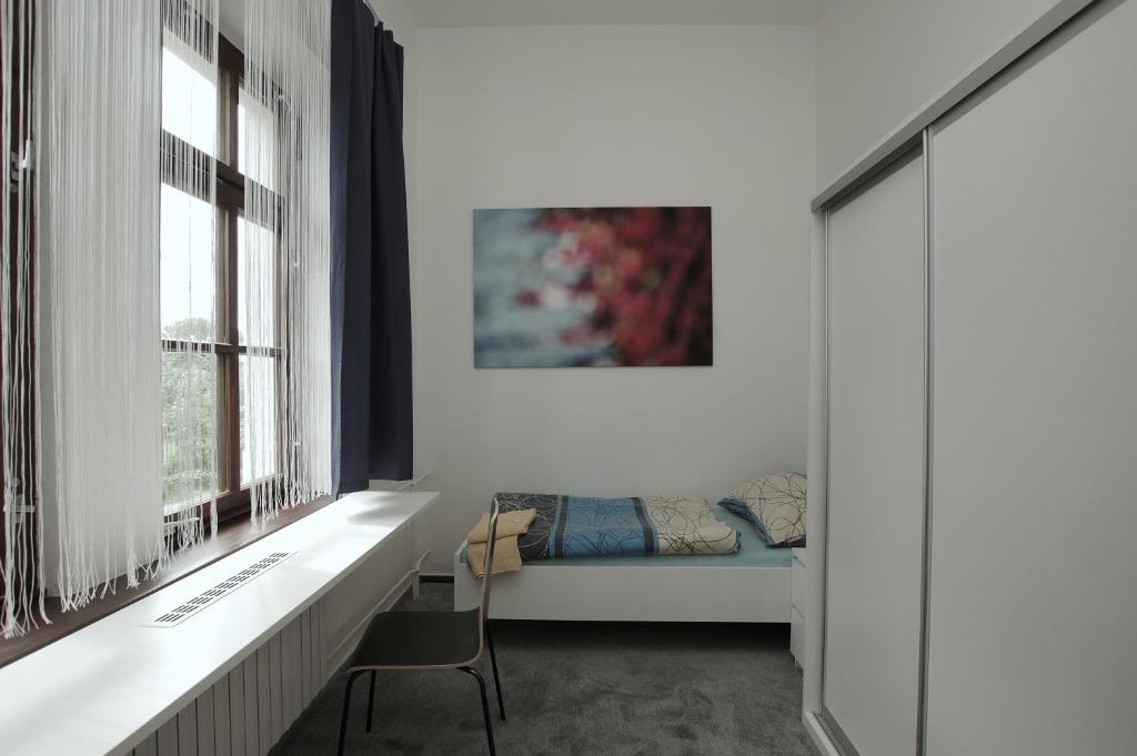 Postel nebo postele na pokoji v ubytování Koleje Zamecek