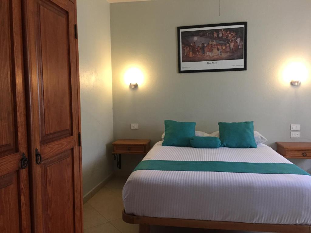 Postel nebo postele na pokoji v ubytování Hotel RV Park San Ramón