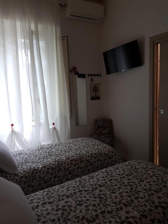 Posteľ alebo postele v izbe v ubytovaní Il Giardino Di Vico Neve