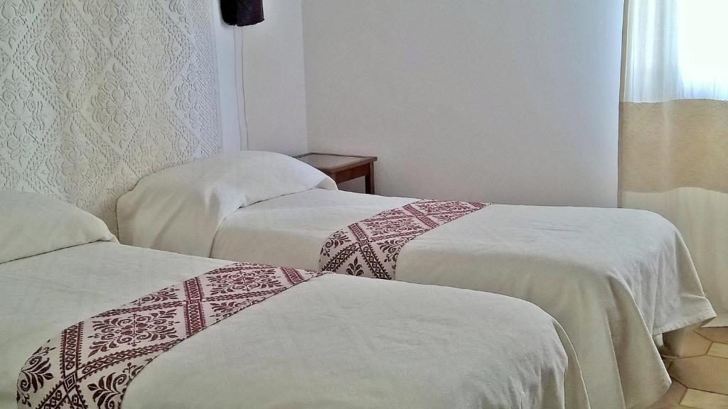 Postel nebo postele na pokoji v ubytování Antonhouse Alghero