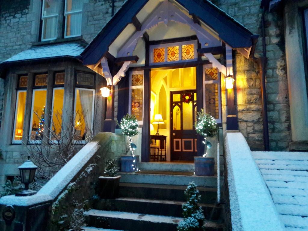 a house with a staircase leading to a balcony at Grange Boutique Hotel in Grange Over Sands