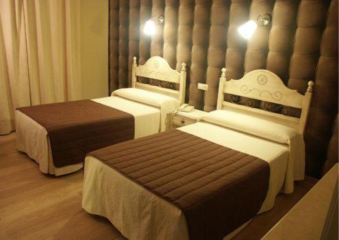 Postel nebo postele na pokoji v ubytování HOSTAL-CAFE GUTGRECO