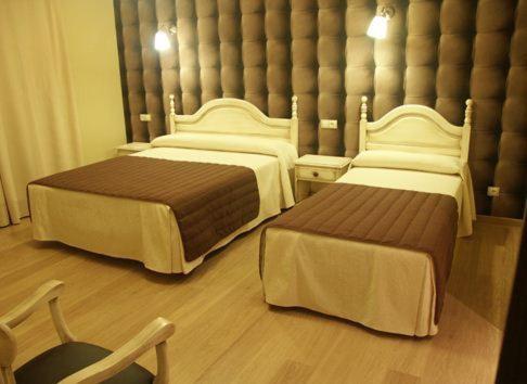 Postel nebo postele na pokoji v ubytování HOSTAL-CAFE GUTGRECO