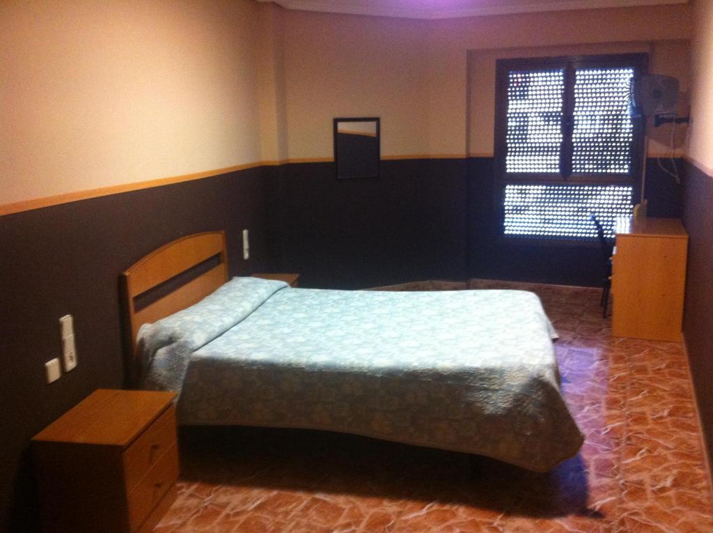 Postel nebo postele na pokoji v ubytování Hotel Manises