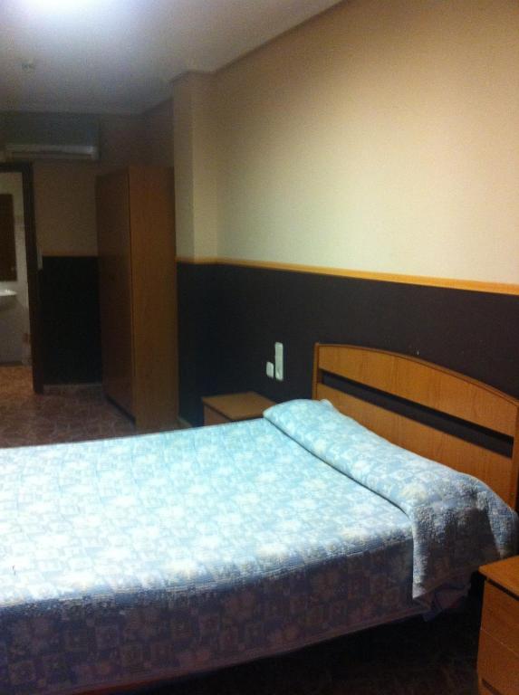 Postel nebo postele na pokoji v ubytování Hotel Manises