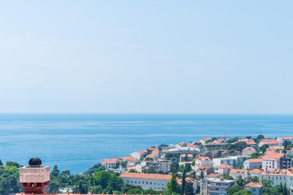 a view of a city and the ocean at Rooms Nikola in Dubrovnik