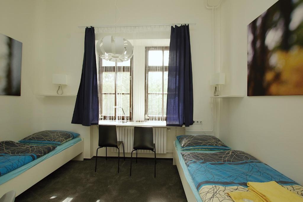 Postel nebo postele na pokoji v ubytování Koleje Zamecek