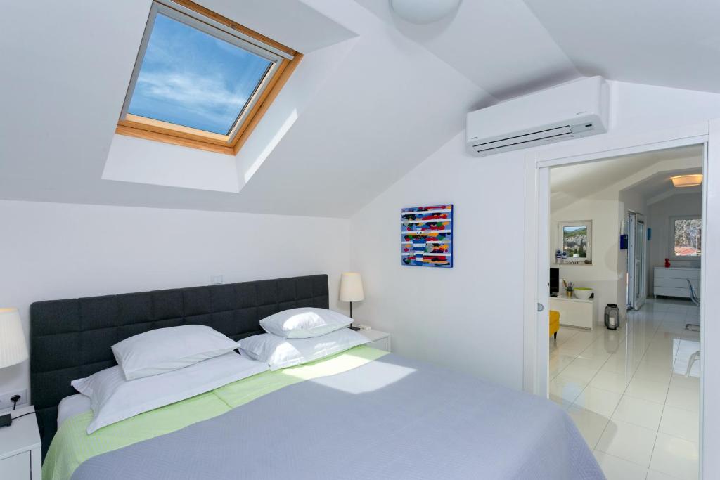 Postel nebo postele na pokoji v ubytování Blue Bay Residence