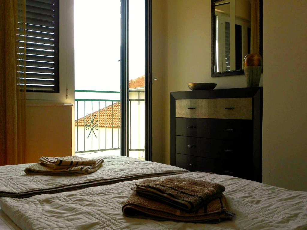Postel nebo postele na pokoji v ubytování Apartments Aleksandra