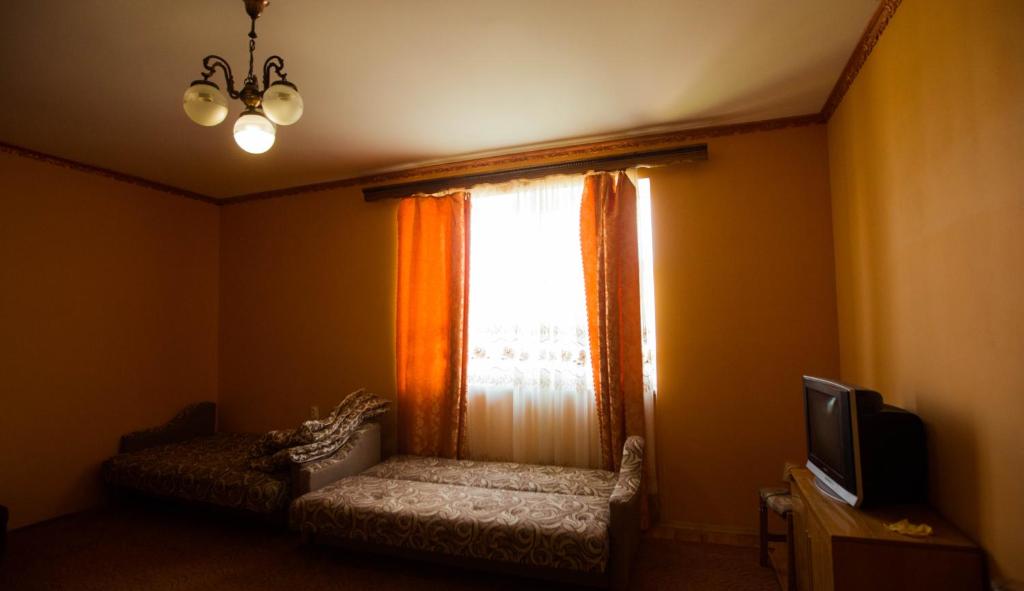 TV a/nebo společenská místnost v ubytování Guest House in Drachino