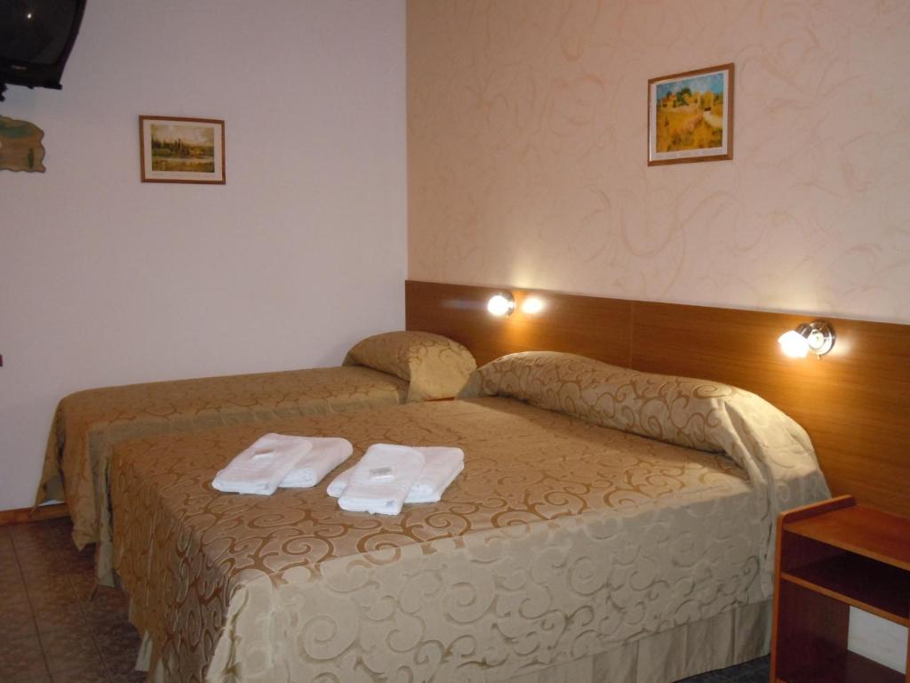Postel nebo postele na pokoji v ubytování IRUPÉ APART HOTEL