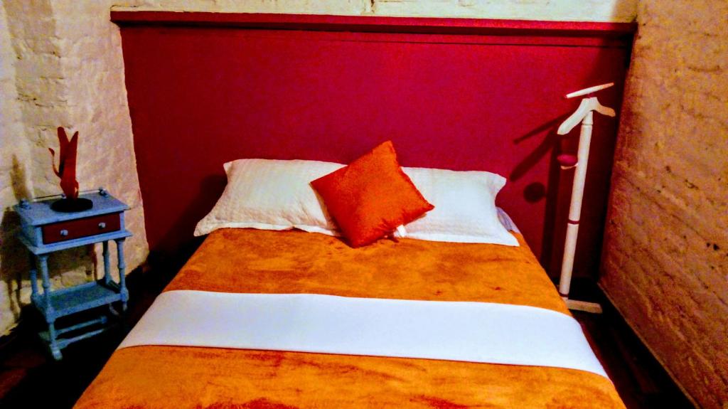 Postel nebo postele na pokoji v ubytování Lima Limon Candelaria Hostel