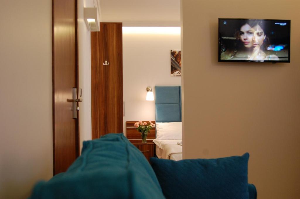 Televízia a/alebo spoločenská miestnosť v ubytovaní Villa Star