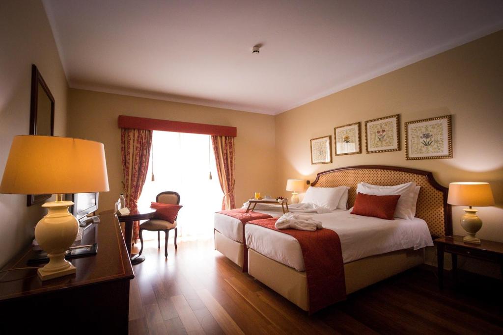 Postel nebo postele na pokoji v ubytování Hotel Talisman