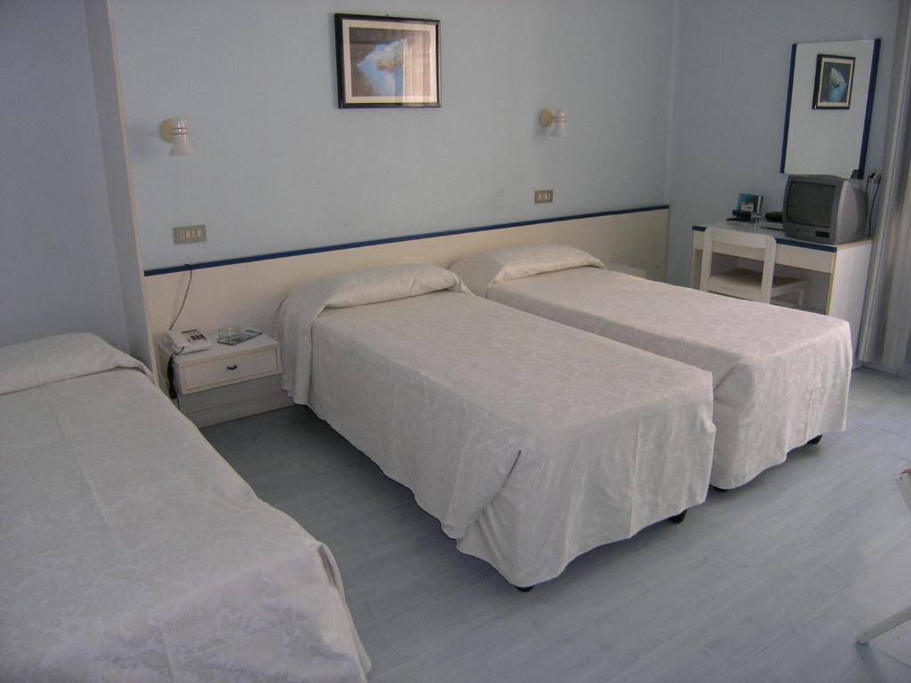 Postel nebo postele na pokoji v ubytování Elba Hotel