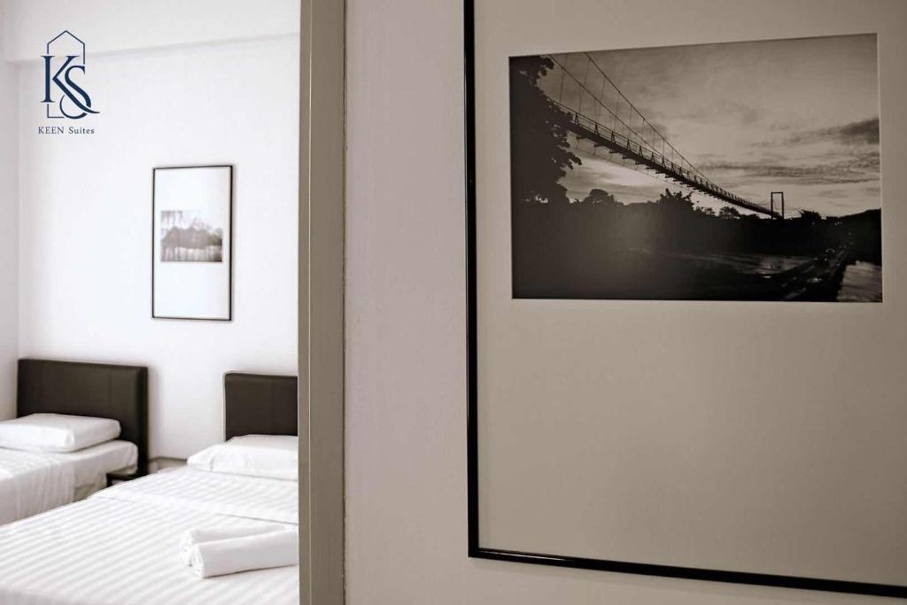 KEEN Suites@Sutera Avenueにあるベッド
