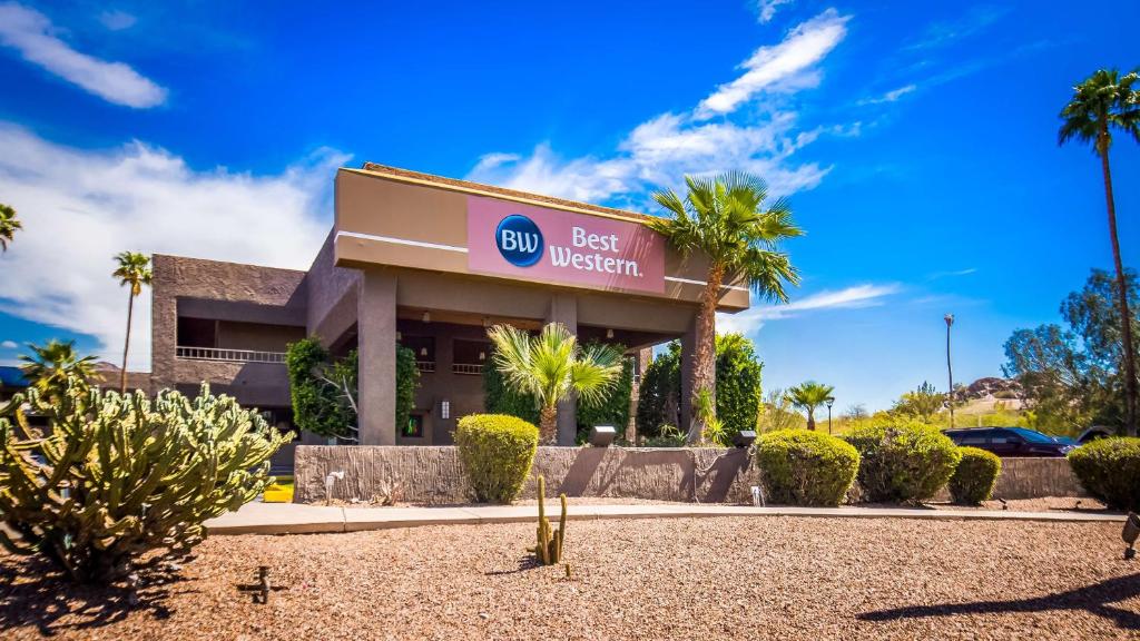 a best western sign in front of a building at Best Western InnSuites Phoenix Hotel & Suites in Phoenix