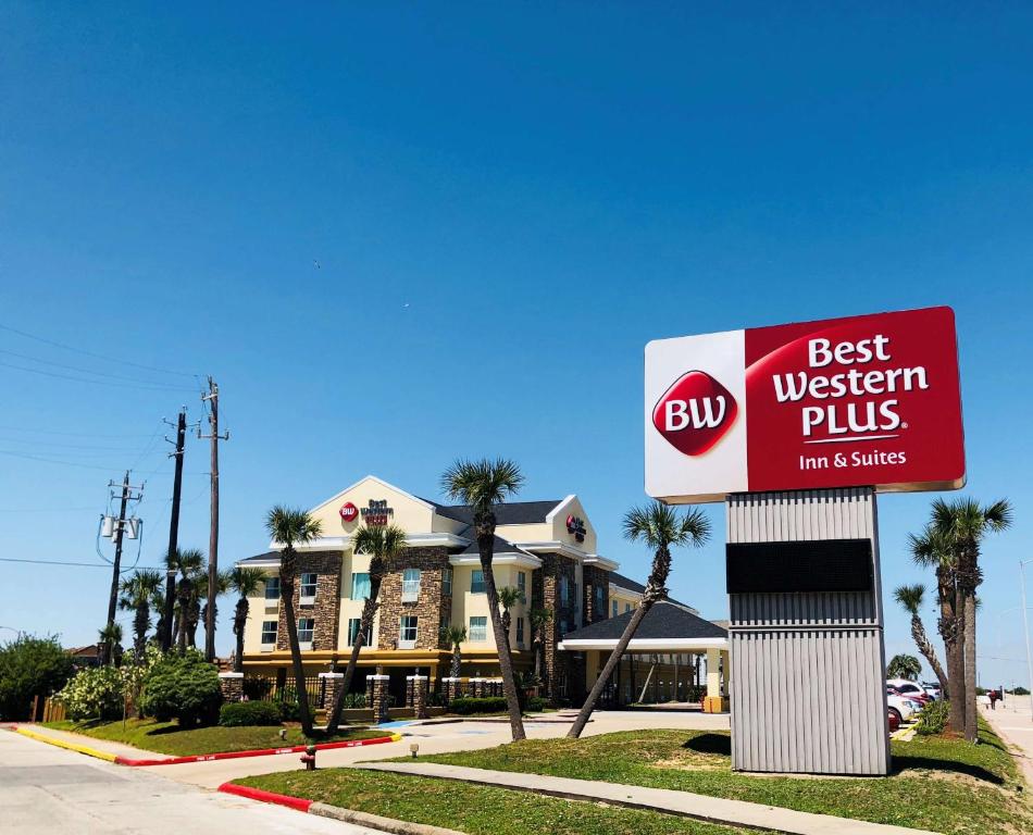 a best western plus sign in front of a hotel at Best Western Plus Seawall Inn & Suites by the Beach in Galveston