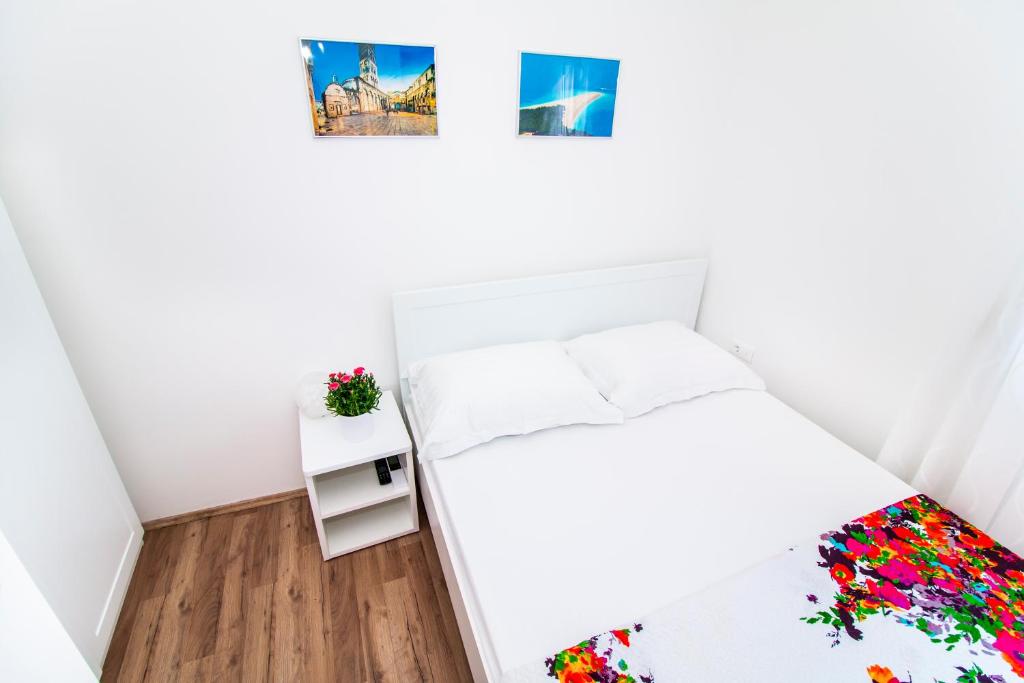 Posteľ alebo postele v izbe v ubytovaní Apartman Nella