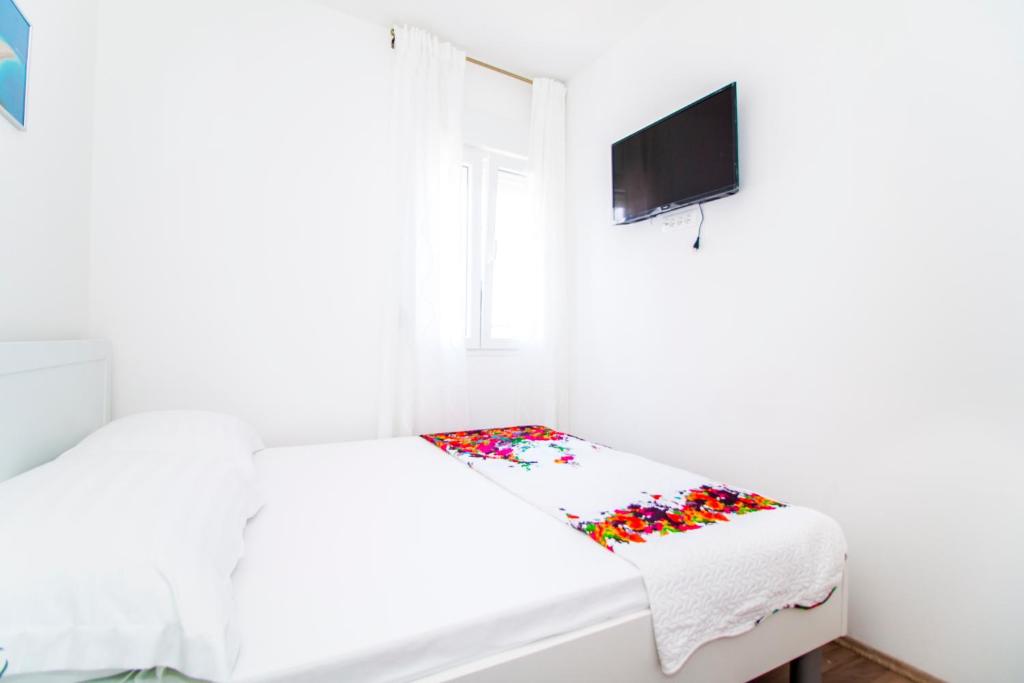 Posteľ alebo postele v izbe v ubytovaní Apartman Nella